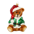 Load image into Gallery viewer, Teddy bear in a green cub. Handmade Glass Christmas ornament.
