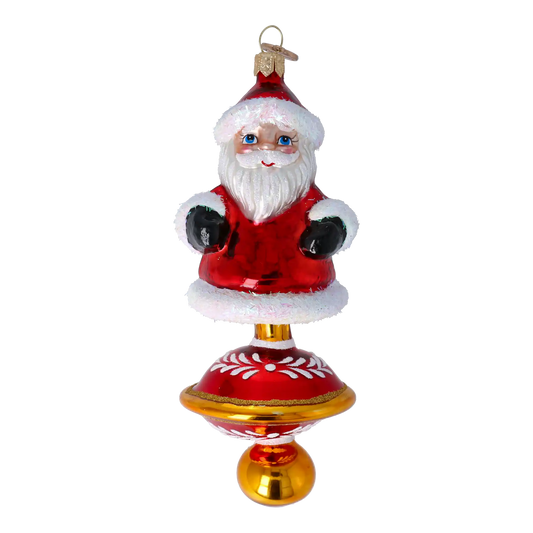 Ornament Merry Santa Claus on a spinning wheel. Handmade Glass Christmas ornament.